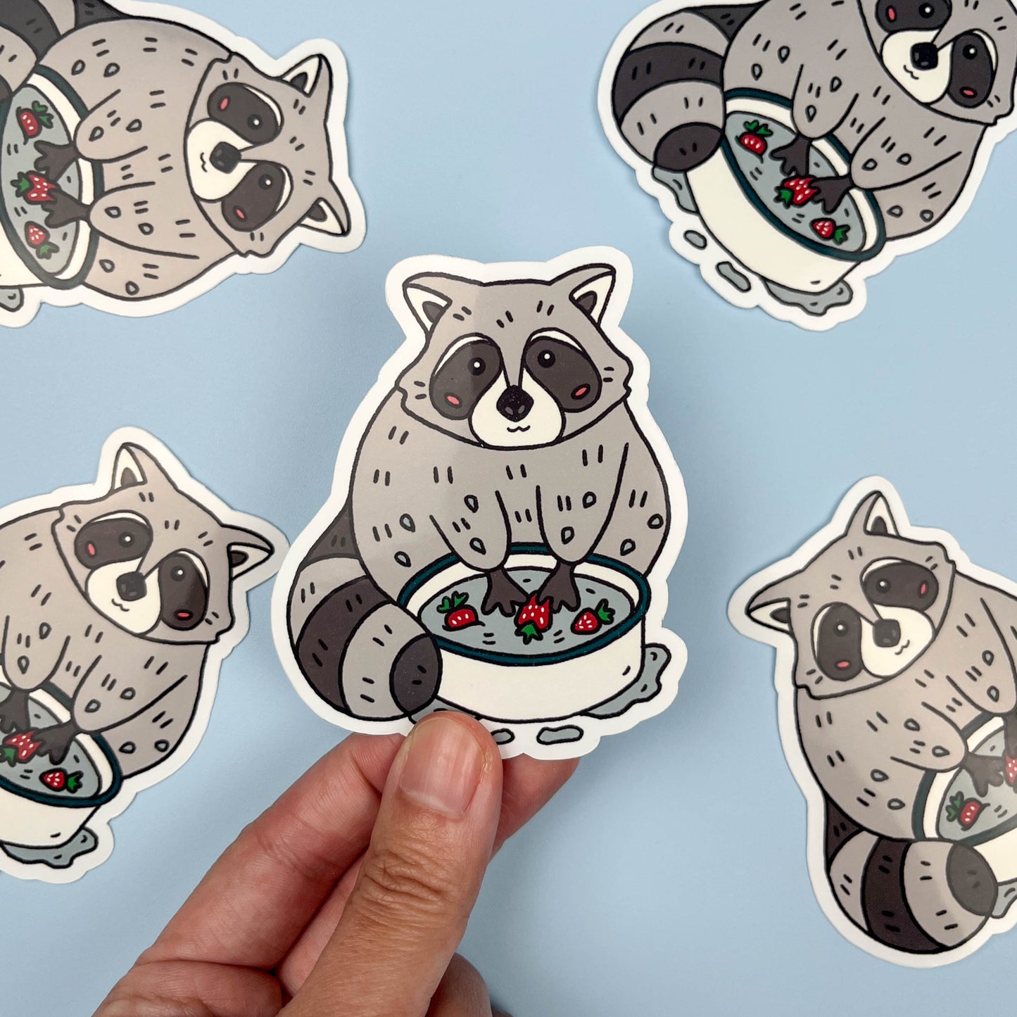 Raccoon Washing Strawberries Sticker